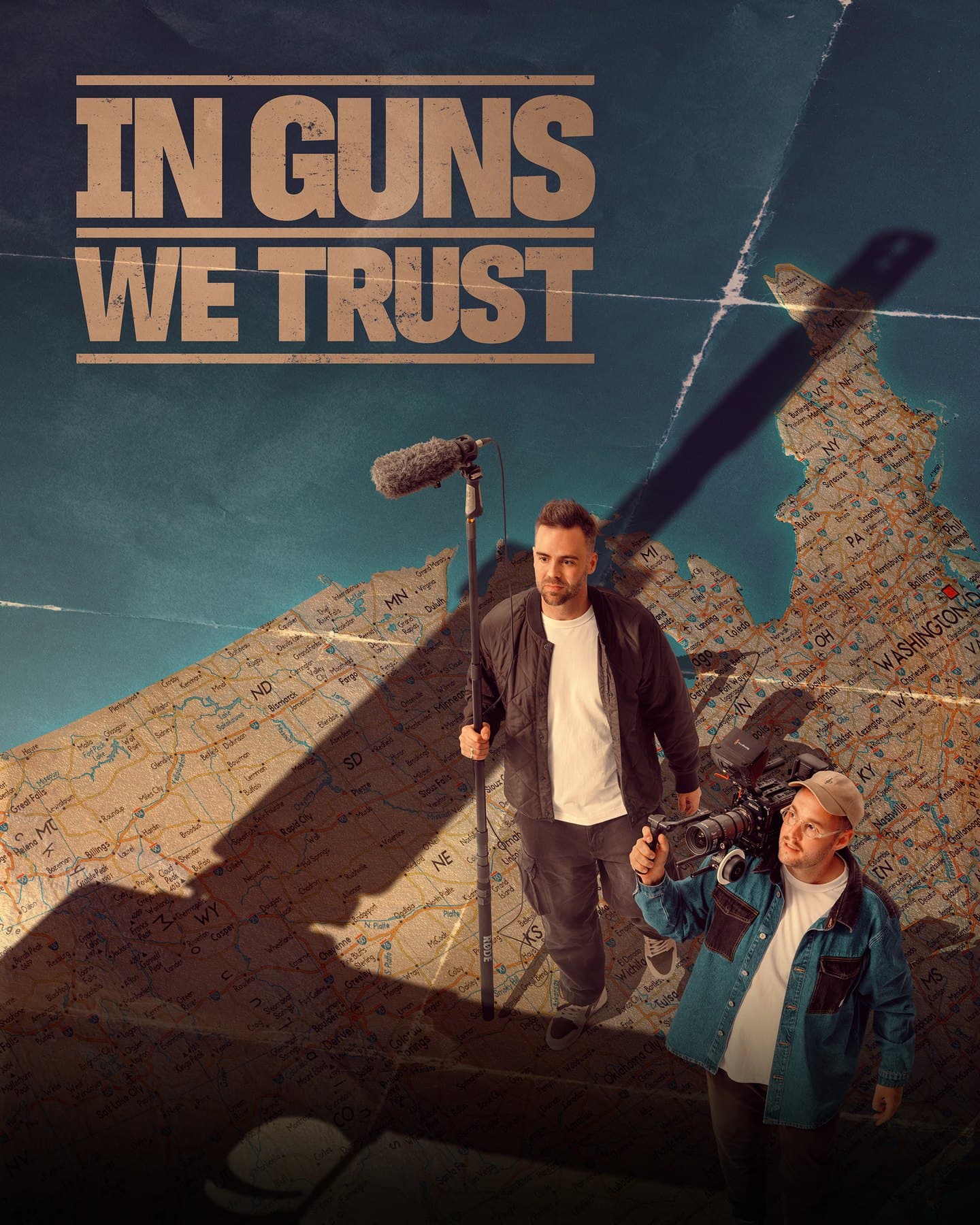 In Guns We Trust — official poster. Tommy Jackett and Josh Janssen stand on a map of the United States under the shadow of a gun.
